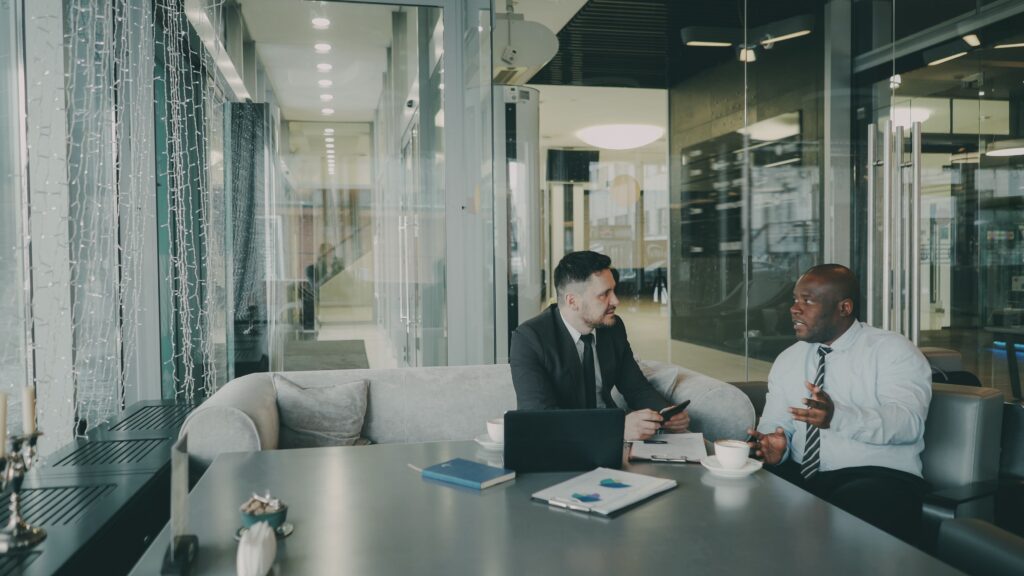Business professionals discussing a client project in an office