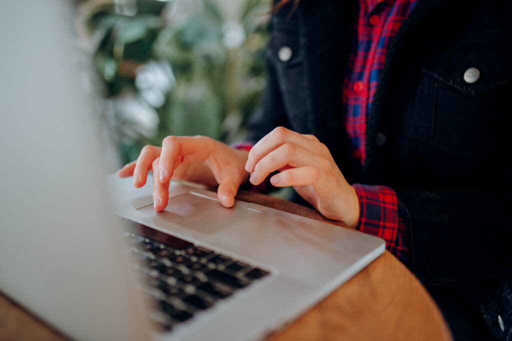 Freelancer organizing client tasks and project deadlines on a laptop