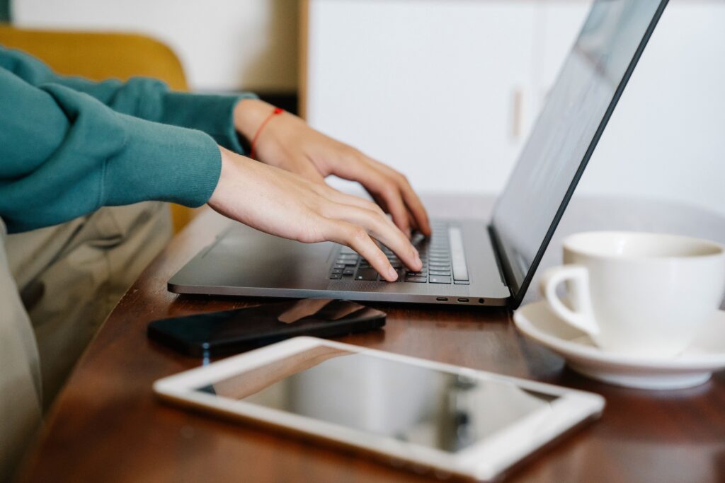 Freelancer using a laptop to manage clients and projects